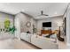 Spacious living room with light colored sectional sofa and access to a deck at 1099 North Ne Ave # 13, Atlanta, GA 30307