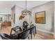 Bright dining room features a glass table, six chairs, and contemporary wall art at 1099 North Ne Ave # 7, Atlanta, GA 30307