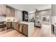 Open concept kitchen with island, stainless steel appliances, and wood cabinets at 1099 North Ne Ave # 7, Atlanta, GA 30307