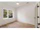 Well-lit bedroom with wood floors and window at 1237 Memorial Se Dr # 101, Atlanta, GA 30316