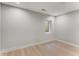Bright bedroom with light hardwood floors and large window at 1099 North Ne Ave # 12, Atlanta, GA 30307