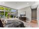 Main bedroom with plush bed and large windows with backyard view at 1099 North Ne Ave # 12, Atlanta, GA 30307
