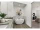 Spa-like bathroom with a freestanding tub and stylish gray tile at 241 Maynard Se Ter # 14, Atlanta, GA 30316