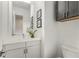 Clean, modern bathroom with white vanity and dark cabinets at 241 Maynard Se Ter # 14, Atlanta, GA 30316