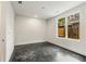 Spacious bedroom with large window and concrete floors at 241 Maynard Se Ter # 14, Atlanta, GA 30316