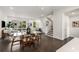 Open concept dining area with glass table and dark hardwood floors at 241 Maynard Se Ter # 14, Atlanta, GA 30316