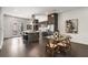 Modern kitchen and dining area with dark hardwood floors at 241 Maynard Se Ter # 14, Atlanta, GA 30316