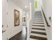 Modern staircase with dark wood steps and white risers at 241 Maynard Se Ter # 14, Atlanta, GA 30316