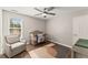 Bedroom with crib, armchair, and hardwood floor at 1022 Fieldstone Dr, Canton, GA 30114