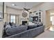 Living room boasts a sectional sofa and fireplace, open to dining area at 2807 High Tide Dr, South Fulton, GA 30349