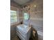 Stylish bathroom featuring a white vanity, marble countertops, and an oval mirror at 2924 Collier Nw Dr, Atlanta, GA 30318