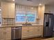 Modern kitchen with granite countertops and stainless steel appliances at 2924 Collier Nw Dr, Atlanta, GA 30318