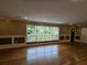 Living room with hardwood floors and wall of windows offering a view at 2924 Collier Nw Dr, Atlanta, GA 30318