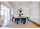 Formal dining room featuring hardwood floors and a modern chandelier at 5877 Riverstone Cir # 17, Atlanta, GA 30339