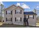 Two-story house with gray siding and black shutters at 403 Breanna Ct, Auburn, GA 30011