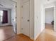 Bright hallway with access to bedrooms and linen closet at 403 Breanna Ct, Auburn, GA 30011