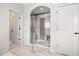 Large walk-in shower with glass enclosure and mosaic tile at 5665 Bridleton Xing, Suwanee, GA 30024