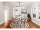 Elegant dining room featuring hardwood floors and stylish light fixture at 1015 Deckner Sw Ave, Atlanta, GA 30310