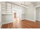 Dining room with built-in shelving and hardwood floors at 1015 Deckner Sw Ave, Atlanta, GA 30310