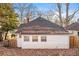 Rear view of a white house with a gabled roof and surrounded by trees at 1015 Deckner Sw Ave, Atlanta, GA 30310