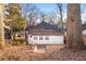 White house back with three windows, steps leading to a yard, and large trees at 1015 Deckner Sw Ave, Atlanta, GA 30310