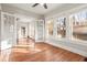 Bright living room with hardwood floors and French doors leading to backyard at 1015 Deckner Sw Ave, Atlanta, GA 30310