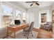 Home office with hardwood floors and built-in shelving at 1015 Deckner Sw Ave, Atlanta, GA 30310
