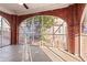 Relaxing screened porch with brick flooring and arch windows at 1015 Deckner Sw Ave, Atlanta, GA 30310