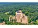 Aerial view of a luxurious house with extensive equestrian facilities at 1730 Etchison Spur, Loganville, GA 30052