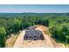 New house and separate garage on a large lot with wooded surroundings at 1730 Etchison Spur, Loganville, GA 30052