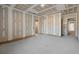 Unfinished basement room with door to hallway at 1730 Etchison Spur, Loganville, GA 30052