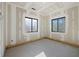 Unfinished bedroom with two windows at 1730 Etchison Spur, Loganville, GA 30052