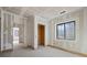 Unfinished bedroom with window and closet at 1730 Etchison Spur, Loganville, GA 30052