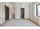 Spacious bedroom with large window and unfinished walls at 1730 Etchison Spur, Loganville, GA 30052