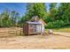 New home construction site, featuring a shed and wooden fence at 1730 Etchison Spur, Loganville, GA 30052