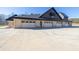 Four-car garage with white doors and brick exterior at 1730 Etchison Spur, Loganville, GA 30052