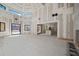 Open concept great room with high ceilings and large windows at 1730 Etchison Spur, Loganville, GA 30052