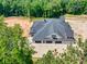 Luxury home with large covered garage and gray roof at 1730 Etchison Spur, Loganville, GA 30052