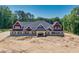 Brick home with a gray roof, red accents and a welcoming front entrance at 1730 Etchison Spur, Loganville, GA 30052