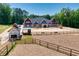 Home under construction with partial view of horse stables at 1730 Etchison Spur, Loganville, GA 30052
