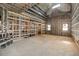 Interior framing of a spacious room under construction, featuring large windows and high ceilings at 1730 Etchison Spur, Loganville, GA 30052