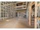 Interior framing of a large open space under construction, showing a two-story high ceiling at 1730 Etchison Spur, Loganville, GA 30052