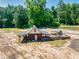Small barn with covered area and adjacent playset at 1730 Etchison Spur, Loganville, GA 30052