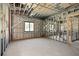 Unfished room with window and metal framing, ready for interior build-out at 1730 Etchison Spur, Loganville, GA 30052