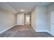 Carpeted bedroom with multiple doors at 105 Sunflower Ne Cir, Cartersville, GA 30121