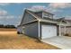 Gray house exterior with white garage door and landscaping at 105 Sunflower Ne Cir, Cartersville, GA 30121