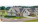 White two-story house with gray roof and landscaping; wider angle view at 1659 Tielman Way, Snellville, GA 30078