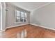 Bright living room featuring hardwood floors and a large window at 5408 Anemone Nw Ct, Acworth, GA 30102