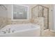 Bathroom with soaking tub and walk-in shower at 88 Boulder View Dr, Dallas, GA 30157