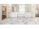 Large main bathroom with double vanity and marble floors at 3862 Stratford Park Ne Dr, Atlanta, GA 30342